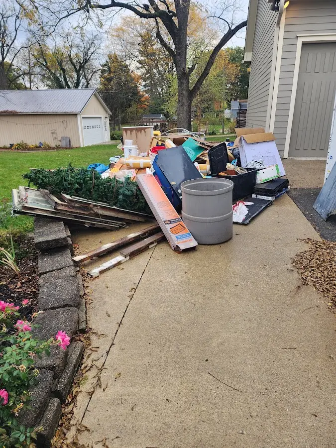 Dumpster being loaded with debris for 3 Yard Dumpster Rental in Mount Sterling